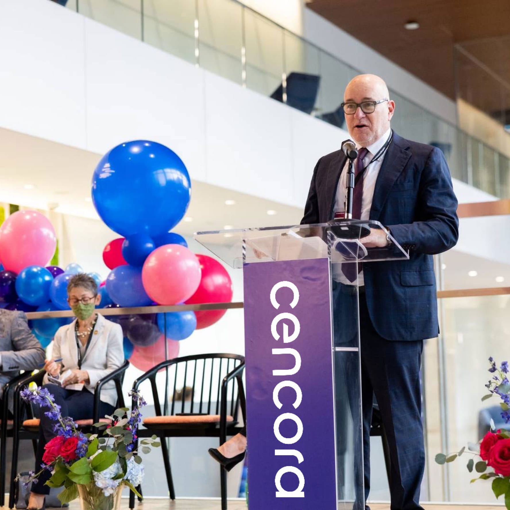 Steve H. Collis, the Chairman, President, and Chief Executive Officer of Cencora, speaking at a podium during a corporate event.