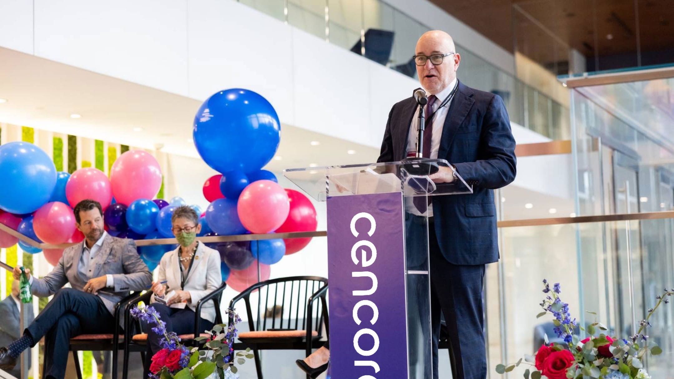 Steve H. Collis, the Chairman, President, and Chief Executive Officer of Cencora, speaking at a podium during a corporate event.