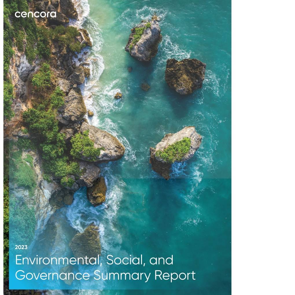 Cencora’s 2023 Environmental, Social, and Governance Report PDF cover thumbnail. The image is an overhead view of moss-covered rocks along a blue and green body of water.